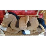A large plush horse with tack