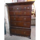 A 3' 5" antique oak chest on chest with moulded top, two short and three long graduated drawers,