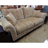 A 6' 10" Parker Knoll two seater settee upholstered in repeat pattern tapestry with two scatter