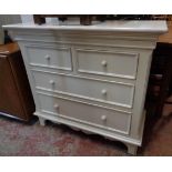 A 3' 2" modern painted wood chest of two short and two long graduated drawers, set on bracket feet