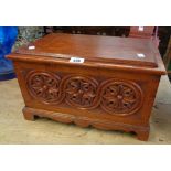 A 17 1/2" stained pine lift-top box with Gothic style carving to sides, set on bracket feet