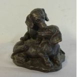 A bronzed resin dachshund group