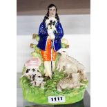 A Staffordshire figure of a shepherd with flock