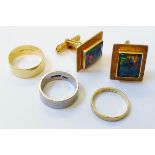 Two 750 and one 18ct. gold bands of varying design - sold with a pair of marked 18ct. yellow metal