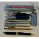 A Mont Blanc rollerball pen - sold with a collection of Parker ballpoint pens and a Cross rolled