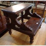 A set of reproduction mahogany library steps with decorative pierced ends and turned supports