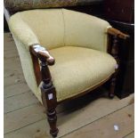 An antique stained beech part show frame child's tub chair with old gold upholstery, set on turned