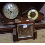 An oak cased eight day gong striking mantel clock, a walnut cased Art Deco similar and a Smiths