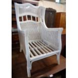 A bentwood and bergere panelled elbow chair frame with later painted finish