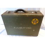 A vintage US Navy fibreboard suitcase with contemporary labels