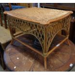 A 31" bentwood and wicker occasional table with woven top and pierced sides