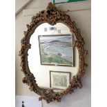 A gilt plaster framed oval wall mirror