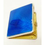 A silver cigarette case with blue enamel and engine turned decoration - Birmingham 1931