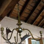 A brass three branch pendant light fitting - sold with seven shades