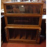 A 36" early 20th Century polished oak Globe Wernicke style storage unit with two bookcase