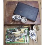 A quantity of silver plated items including cutlery, teapot, lidded bowl, etc. - sold with an oak