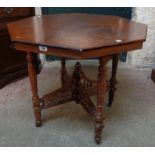 A 32 1/2" Edwardian polished walnut octagonal topped centre table, set on ring turned supports and