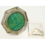 A silver fronted octagonal photograph frame - sold with a silver cigarette box