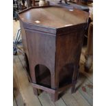A 15 1/2" polished hardwood octagonal occasional table with arcaded lower side panels, in the