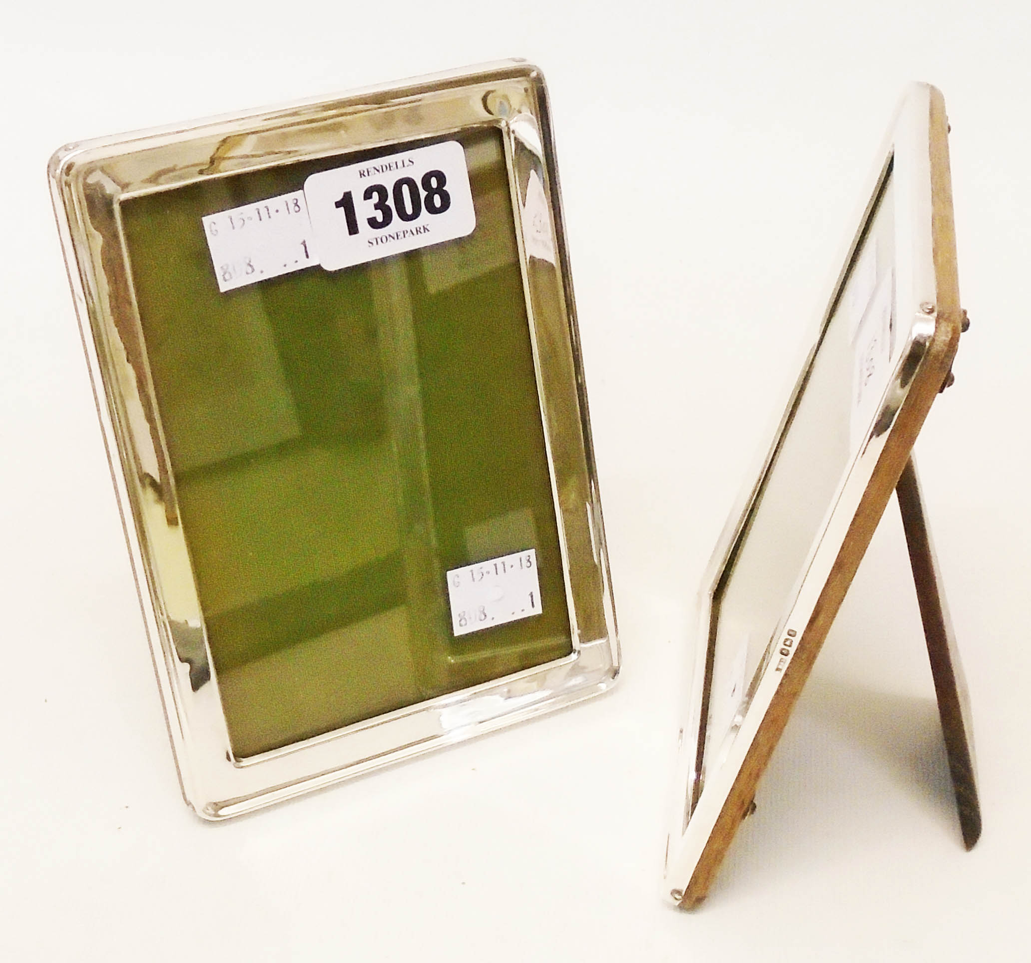 A pair of matching silver fronted oak easel backed photograph frames, by Huxley and Sidebotham -