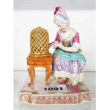 A continental figure of a woman with bird and cage, in the Meissen style - a/f