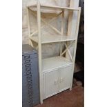 A 25" vintage painted wood three shelf open unit with two door cupboard under