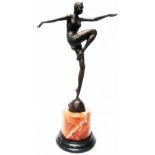 A bronzed Art Deco style female dancer set on a marble socle - overall height 22"