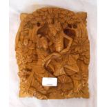 A Thai carved wooden figural wall plaque - sold with a South American carved wooden figure and a