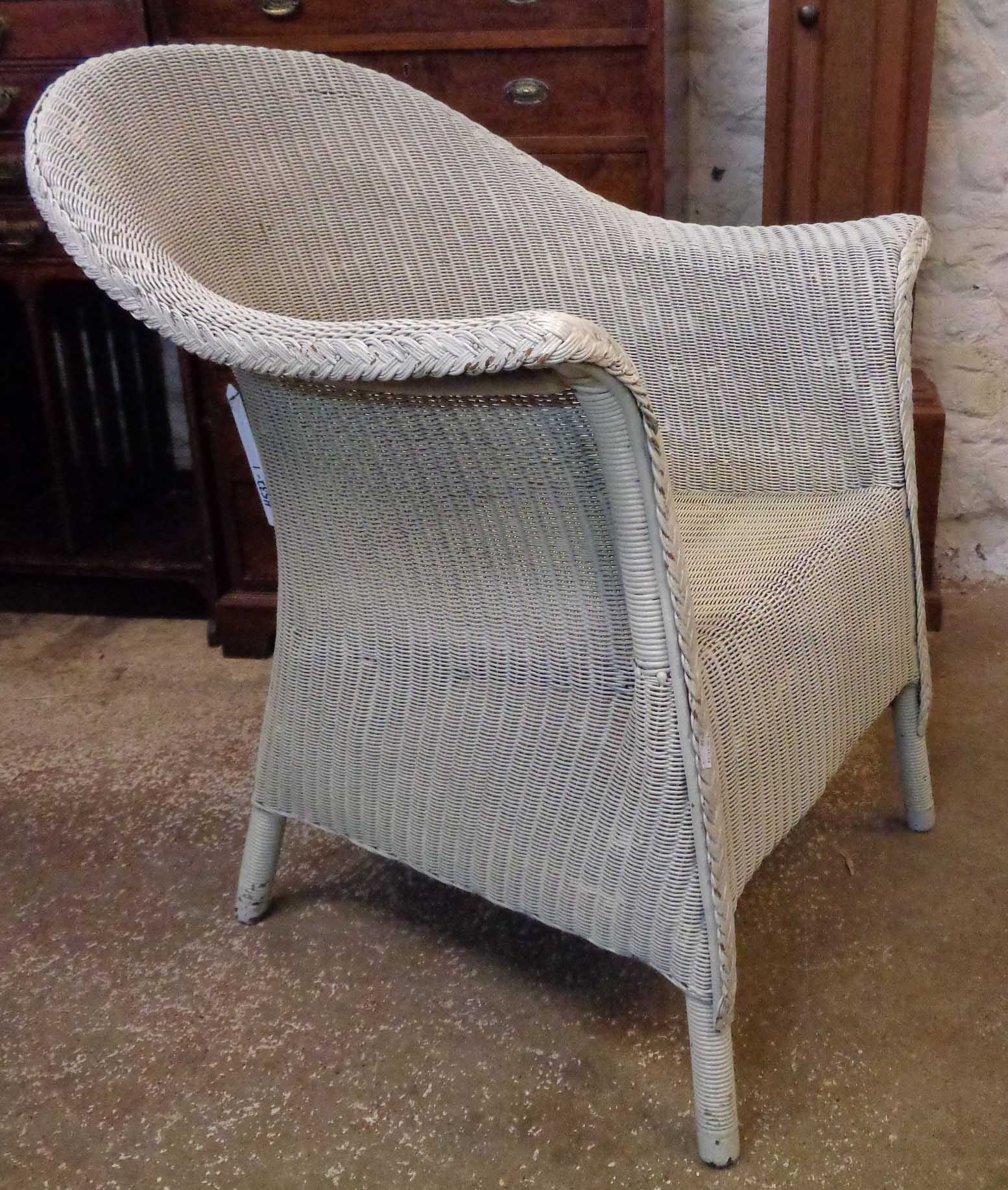 A 1930's Lloyd Loom armchair with later painted finish