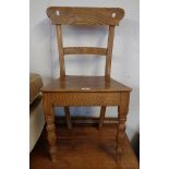 A 19th Century rippled ash standard chair with curved back rail and solid seat, set on turned