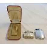 A cased vintage gilt metal Dunhill Rollagas lighter with machined yellow metal finish - sold with