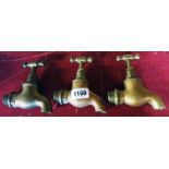A pair of brass taps - sold with another single tap