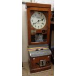 A vintage polished oak cased National Time Recorder Co., Ltd. clocking in/out machine