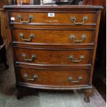 A 25" reproduction walnut bow front chest of four long graduated drawers, set on short cabriole legs