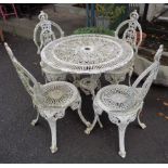 A Victorian style cast aluminium garden table and four chairs