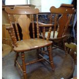 A set of six modern polished pine framed dining chairs with heavy back rails, shaped splats,