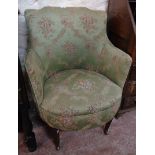 An early 20th Century boudoir tub elbow chair with tapestry upholstery set on square tapered front