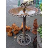 A modern decorative cast iron bird bath