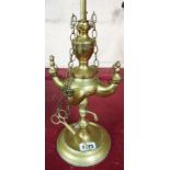 An old eastern brass four branch oil wick lamp standard with chain plugs and snuffer on circular