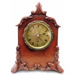 An early 19th Century ornate mahogany cased mantel timepiece, the dial marked for Thwaites & Reed,