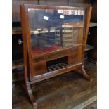 A 19th Century mahogany framed dressing table mirror, set on slender standard ends and swept feet