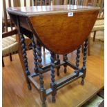 A 24" 1920's polished oak gateleg table, set on barley twist supports