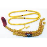 Two amber style prayer bead necklaces