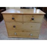 A 3' 5" Victorian waxed pine chest of two short and two long drawers - feet and one handle missing