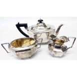 A silver three piece tea service of faceted oval design - Birmingham 1911