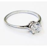 An unmarked white metal diamond solitaire ring - 0.5ct.