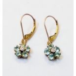A pair of marked 10k yellow metal flower-head pattern drop ear-rings, set with pale blue topaz