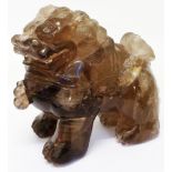 A 4 3/4" 18th Century Chinese smoky quartz carving of a temple lion, with fine detail