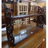 A 27 1/4" 19th Century mahogany wall hanging two shelf open bookcase with decorative pierced