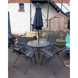A modern patio set comprising four chairs, table and parasol - a/f